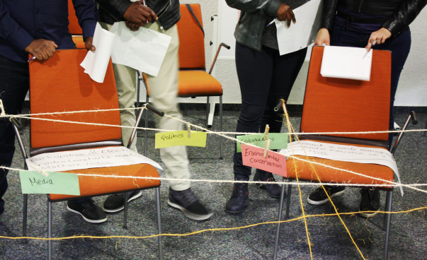 Topics of different projects are written on colourful cards and pinned on a string. Photo: Guilherme H. Maruyama da Costa
